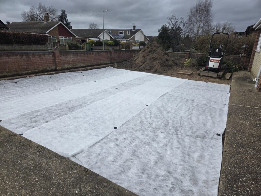 Driveway that has been fully excavated and installed with hardcore base over a stabilising membrane