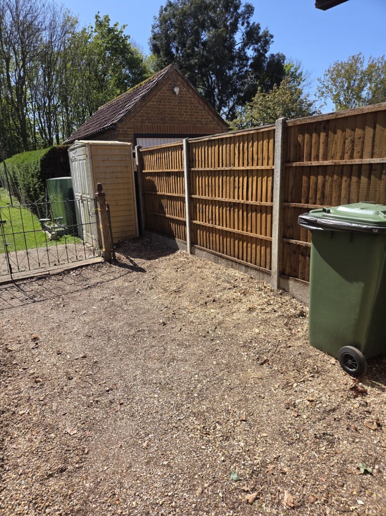 Wooden fence next to newly level ground